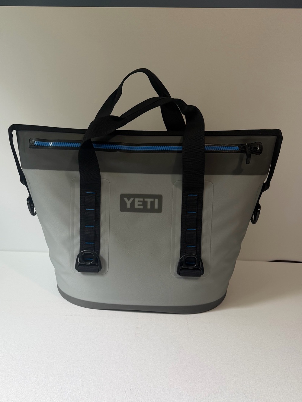 Yeti Hopper Two 30 Tote in Gray with Black Handles and Blue Zipper MSRP: $350